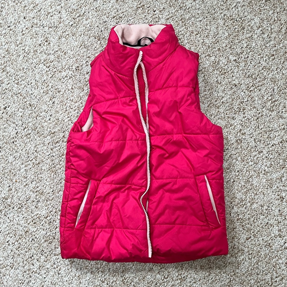Amazon essentials pink vest with zipper pockets size medium.